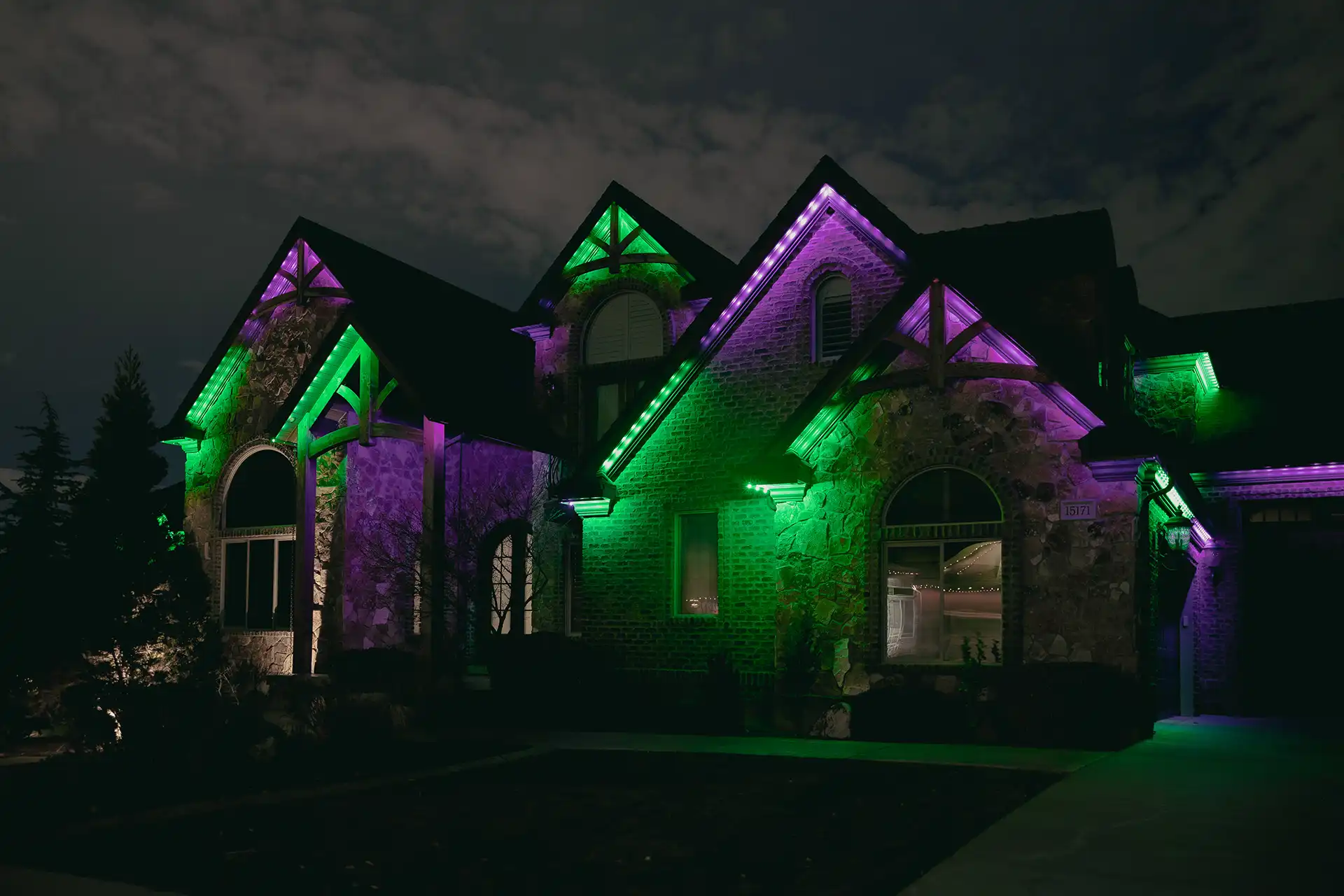 Permanent outdoor lighting on a building at dusk